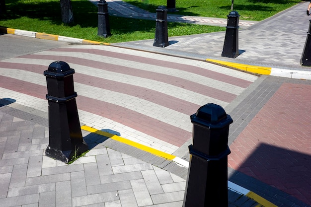 Pedestrian crossing in the city on the highway stone paving from the pavement