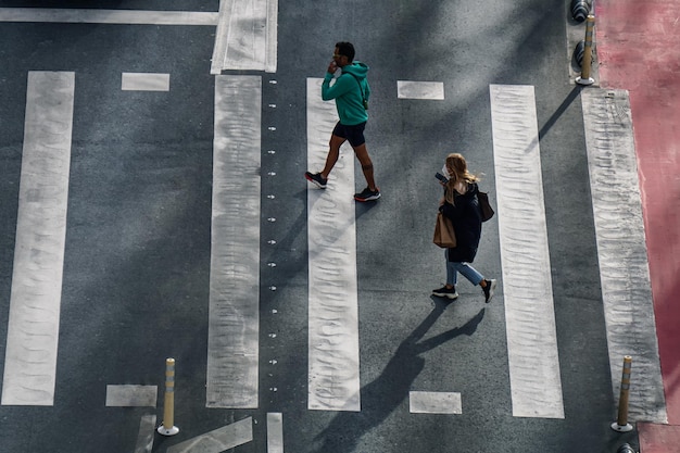 pedestrian crossing the crosswalk in Bilbao city, Basque country, Spain