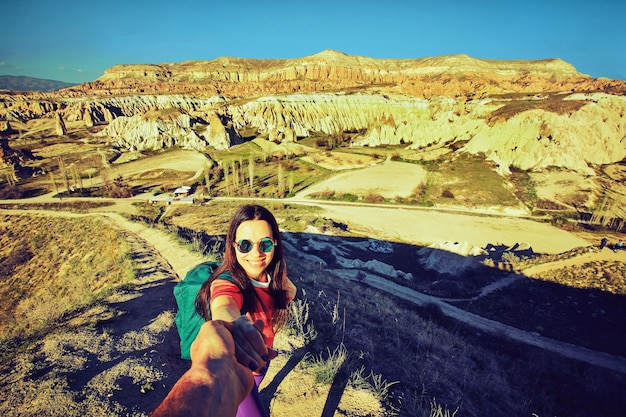 Pedestrian tourism, people travel with backpacks, in the open air.