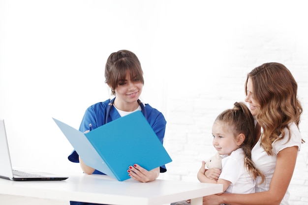 Pediatrician doctor writing prescription