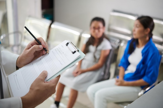 Pediatrician Taking to Preteen Girl