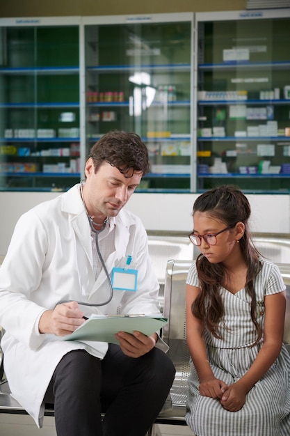 Pediatrician Talking to Preteen Girl