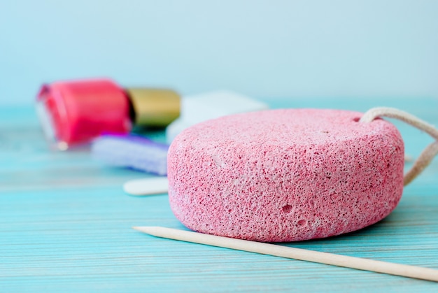 Pedicure accessories with nail polish on wood