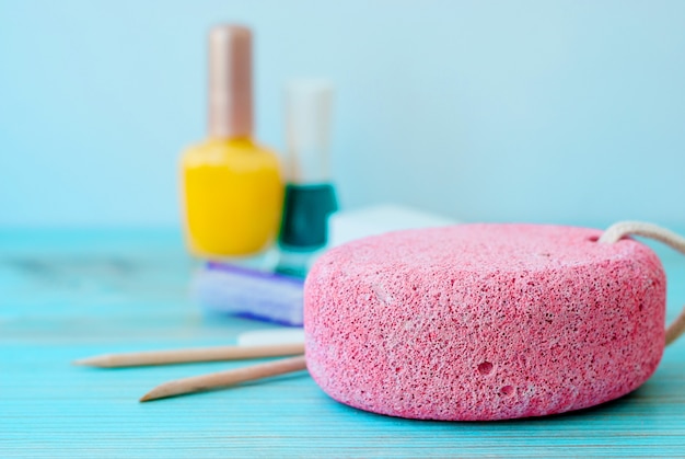 Pedicure accessories with nail polish on wood