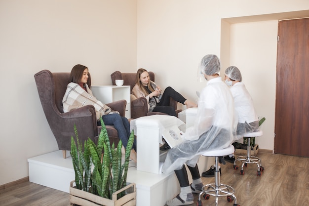 Pedicure in the salon. Master of pedicure doing a procedure for her client. Foot care procedure.