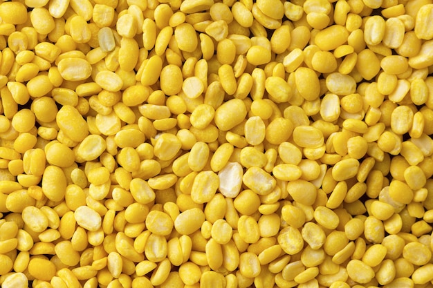 Peeled mung beans on background. top view