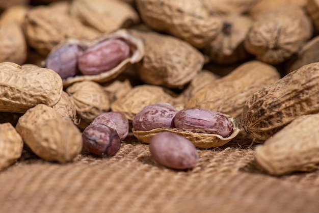 The peeled peanuts are placed among many peanuts