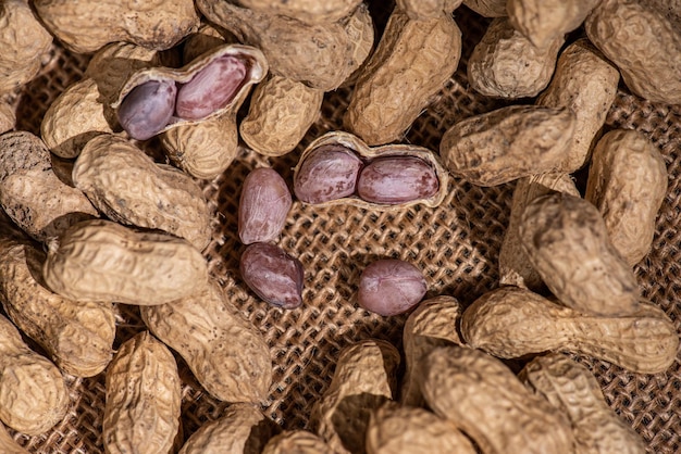 The peeled peanuts are placed among many peanuts