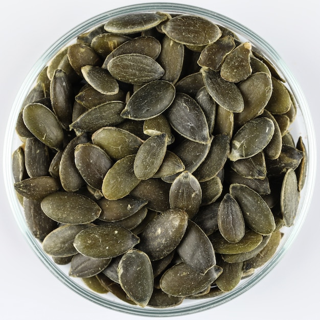 Peeled pumpkin seeds in a glass bowl