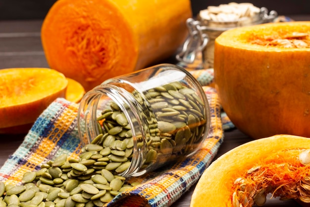 Peeled pumpkin seeds in glass jar