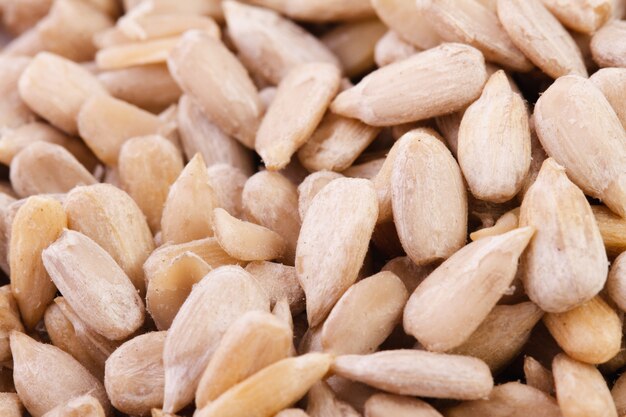 Peeled sunflower seeds, close-up. Vegetarian food