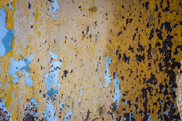 Peeling paint on a metal surface background