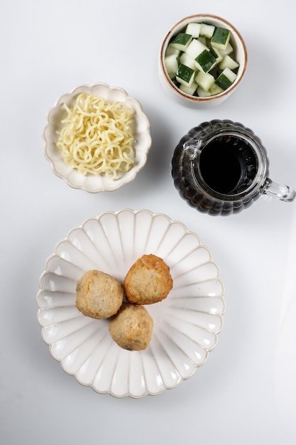 Pempek Adaan or Pempek Bulat is round shape of fish cake from Palembang, served with cuko sauce.