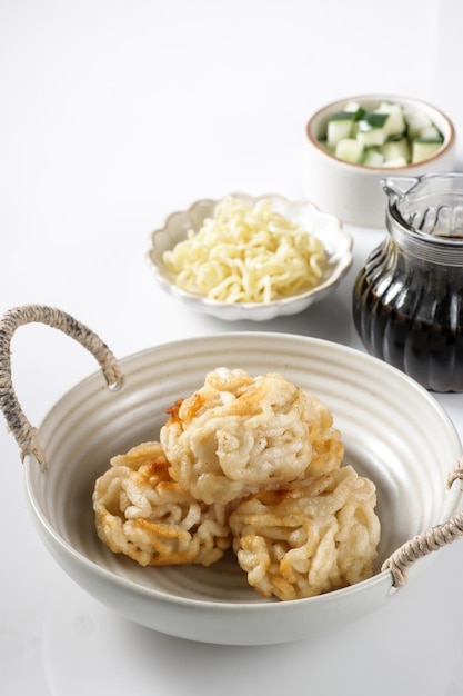 Pempek Keriting or curly fish cake from Palembang, South Sumatera served with cuko.