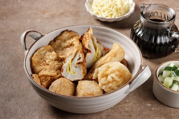 Pempek Palembang is a traditional fish cake from South Sumatera, served with cuko sauce.