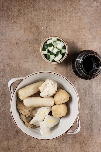 Pempek Palembang Rebus is steamed fish cake served with cuko.