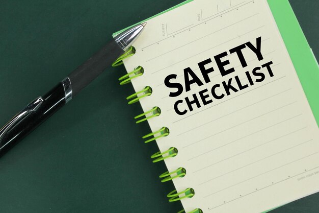 pen and book with the word Safety checklist