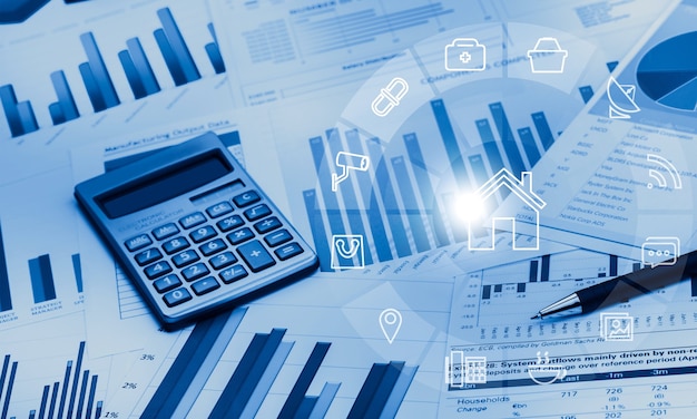 Pen and Calculator on Business Graphs and Charts