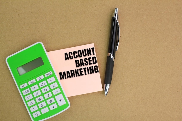 pen and calculator with the words Account Based Marketing on white paper