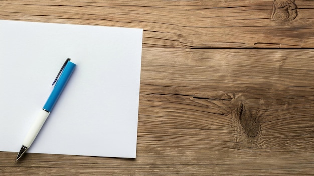 Photo pen and paper on a wooden table