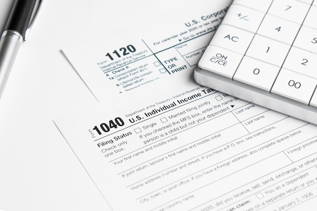 Pen on US TAX form Background. Tax Day concept