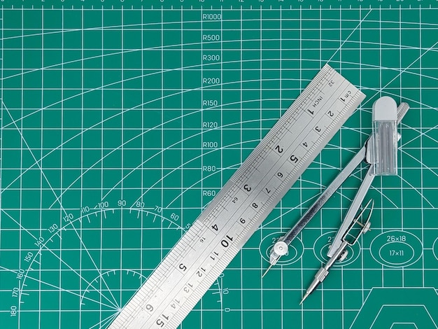 Pencil compass and rulers on cutting mat