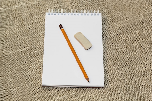 Pencil eraser and clean the notebook