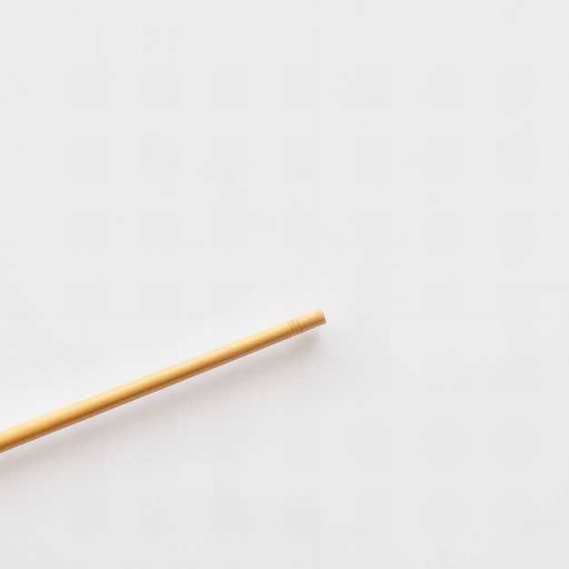 Photo a pencil is leaning against a wall with a wooden handle