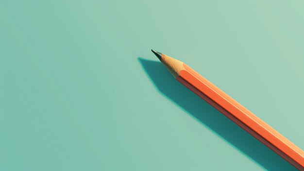 a pencil is sitting on top of a green surface