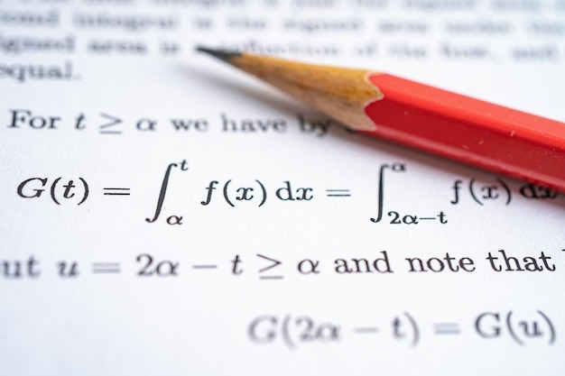 Pencil on mathematic formula exercise test paper in education school