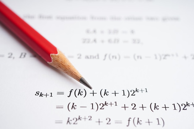 Pencil on mathematic formula exercise test paper in education school