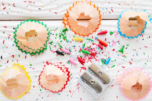 Pencil sharpener on a white wooden background