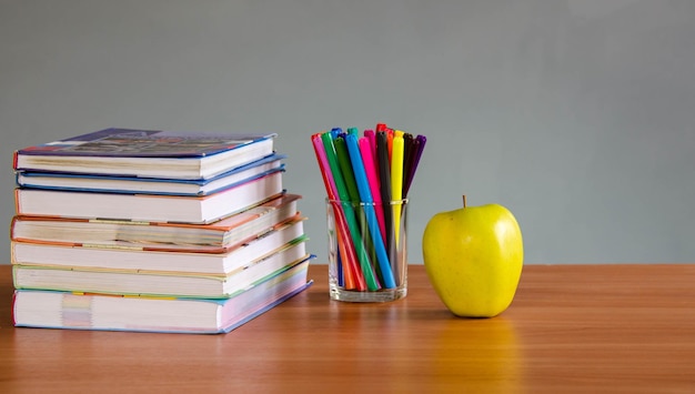 Pencils and books on the table