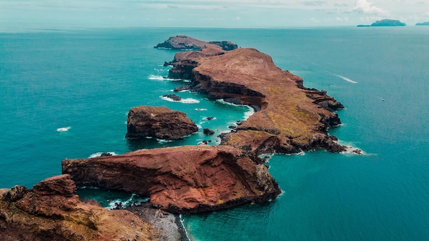 Peninsula cape in Atlantic ocean cliffs rocks on Madeira Portugal aerial photography from drone