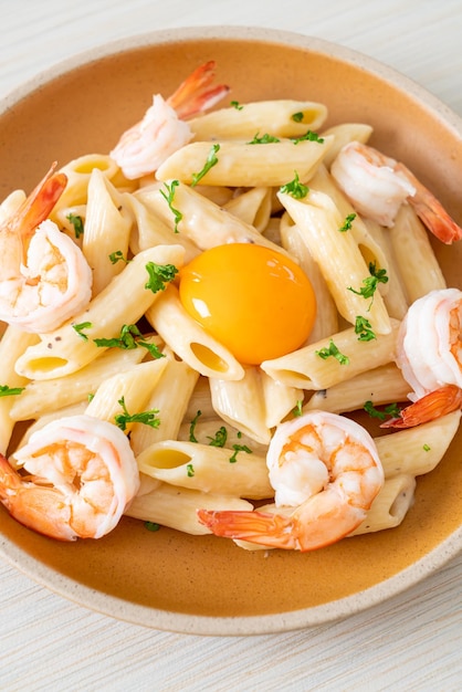 Penne pasta white cream sauce with shrimps and egg