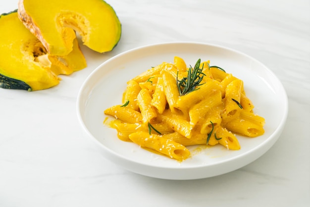 penne pasta with butternut pumpkin creamy sauce and rosemary