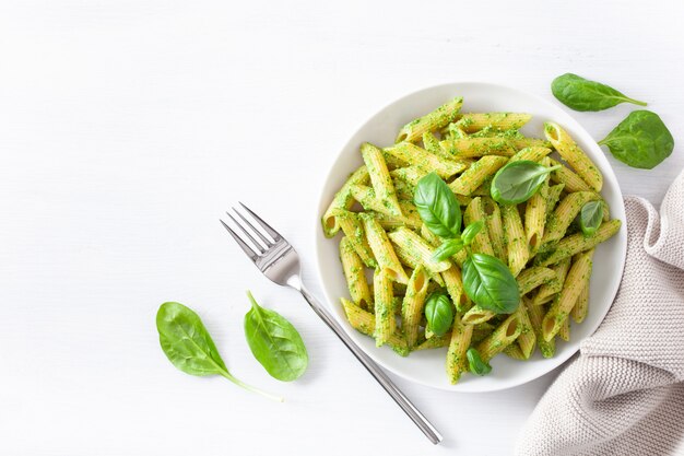 Penne pasta with spinach basil pesto sauce