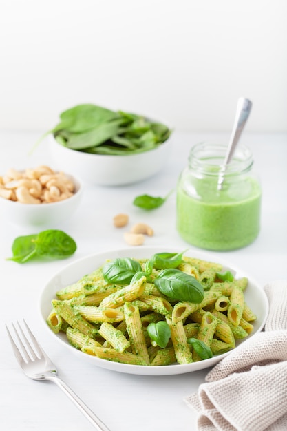 Penne pasta with spinach basil pesto sauce