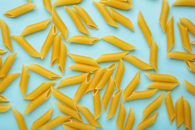 Penne Rigate pasta on a blue background