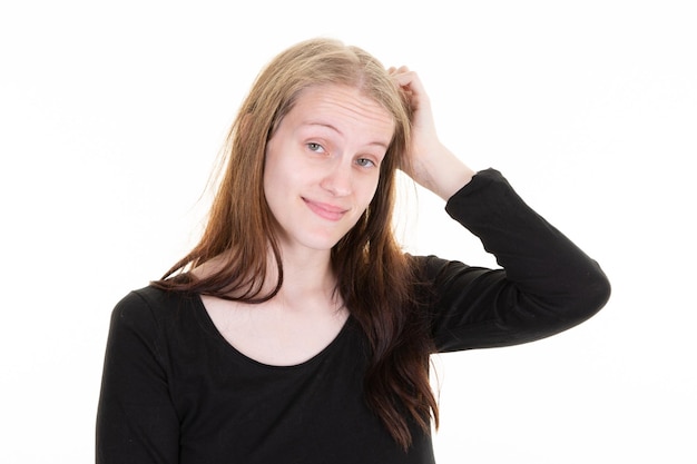 Pensive blonde woman grimaces mouth face scratching beauty head on white background