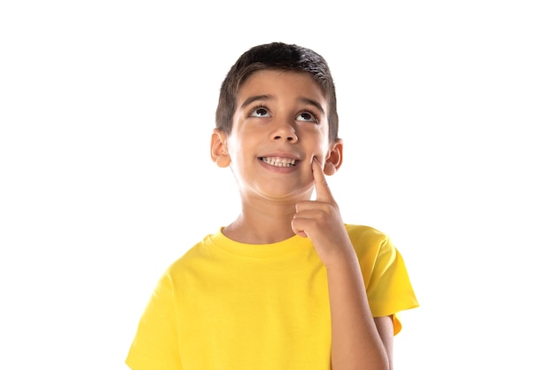 Pensive boy looking up isolated on a white background