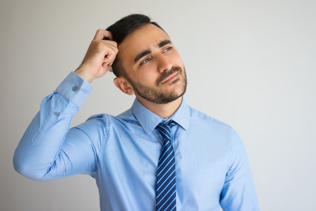 Pensive Businessman Thinking over New Offer