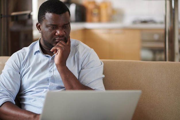 Pensive Entrepreneur Reading Article