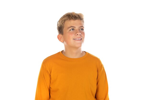 Pensive teenager in orange tshirt