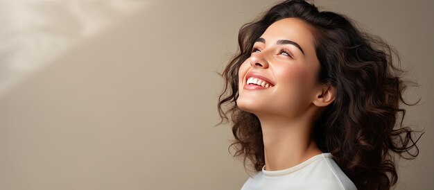 A pensive woman glancing to the side with a joyful expression towards empty white area