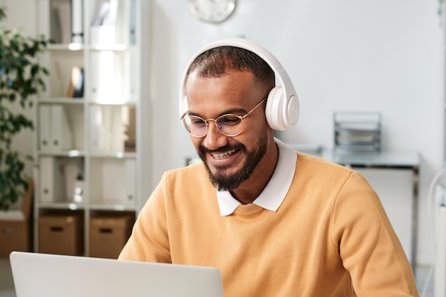 Pensive young black man at workplace