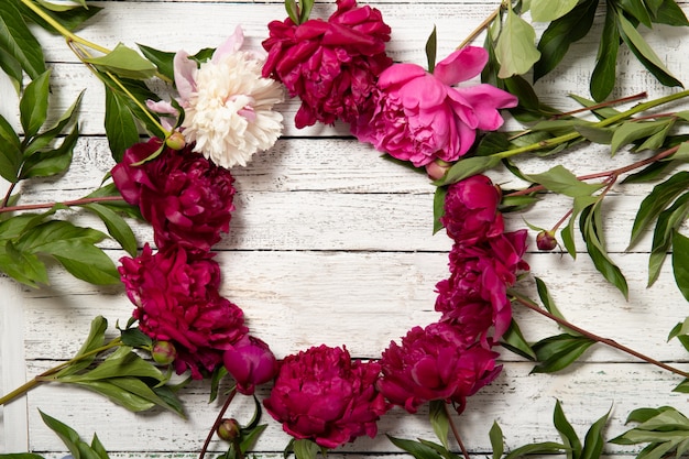 Peonies on a wooden background. Place for text