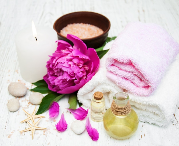 Peony flowers, massage oils and salt