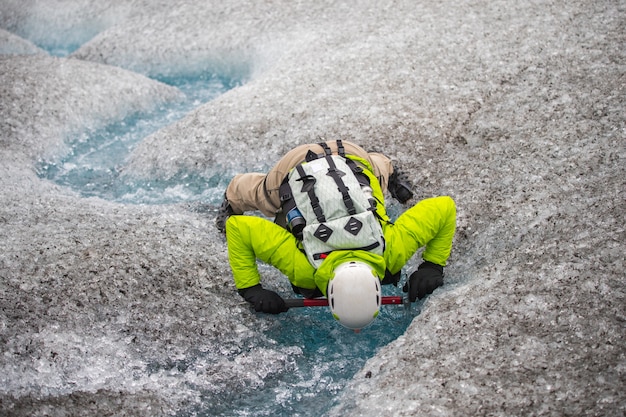 People action show a drinking water in the glacier at Iceland, Summertime