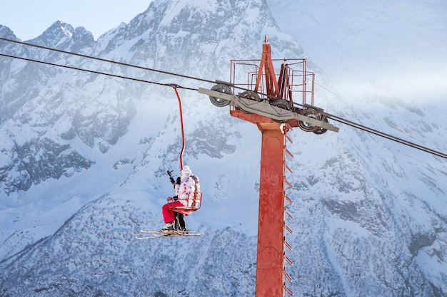 People are lifting on skilift in the mountains